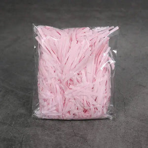 Light pink Shredded paper hamper filler 20grams Santas Workshop Direct